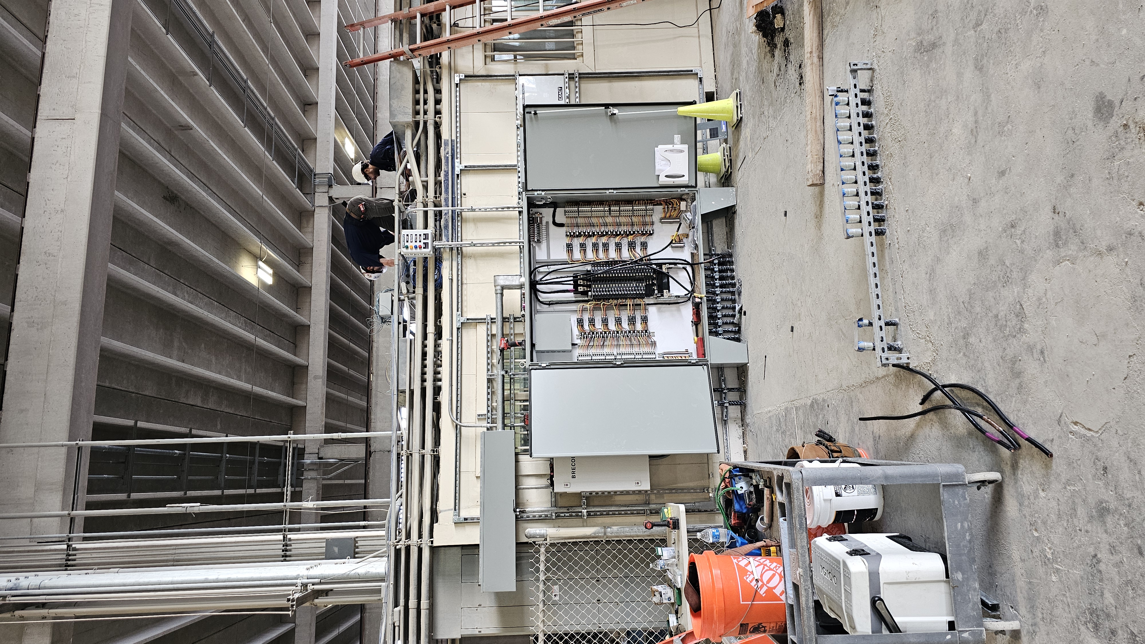 Large commercial electrical panel installation in industrial facility by certified electrician