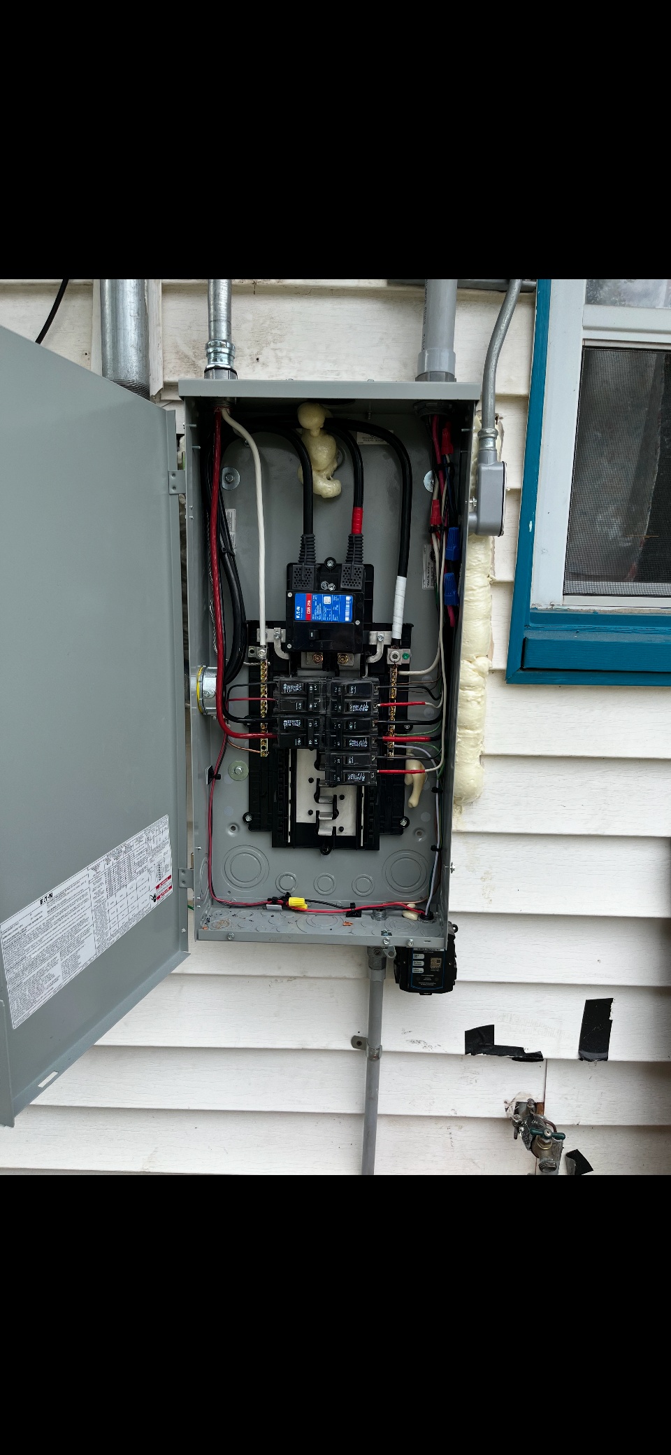 Professional electrical panel installation with circuit breakers and safety features