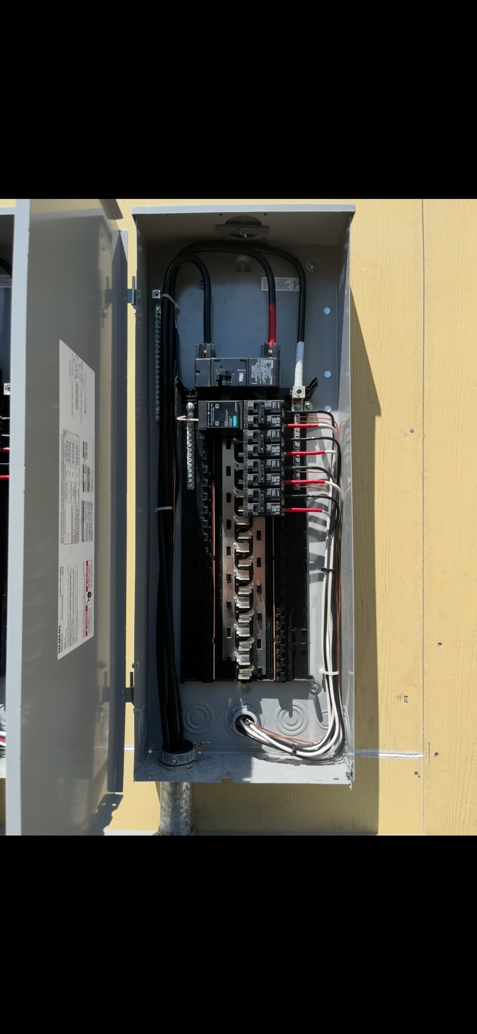 Professional residential electrical panel with neat cable management and safety features