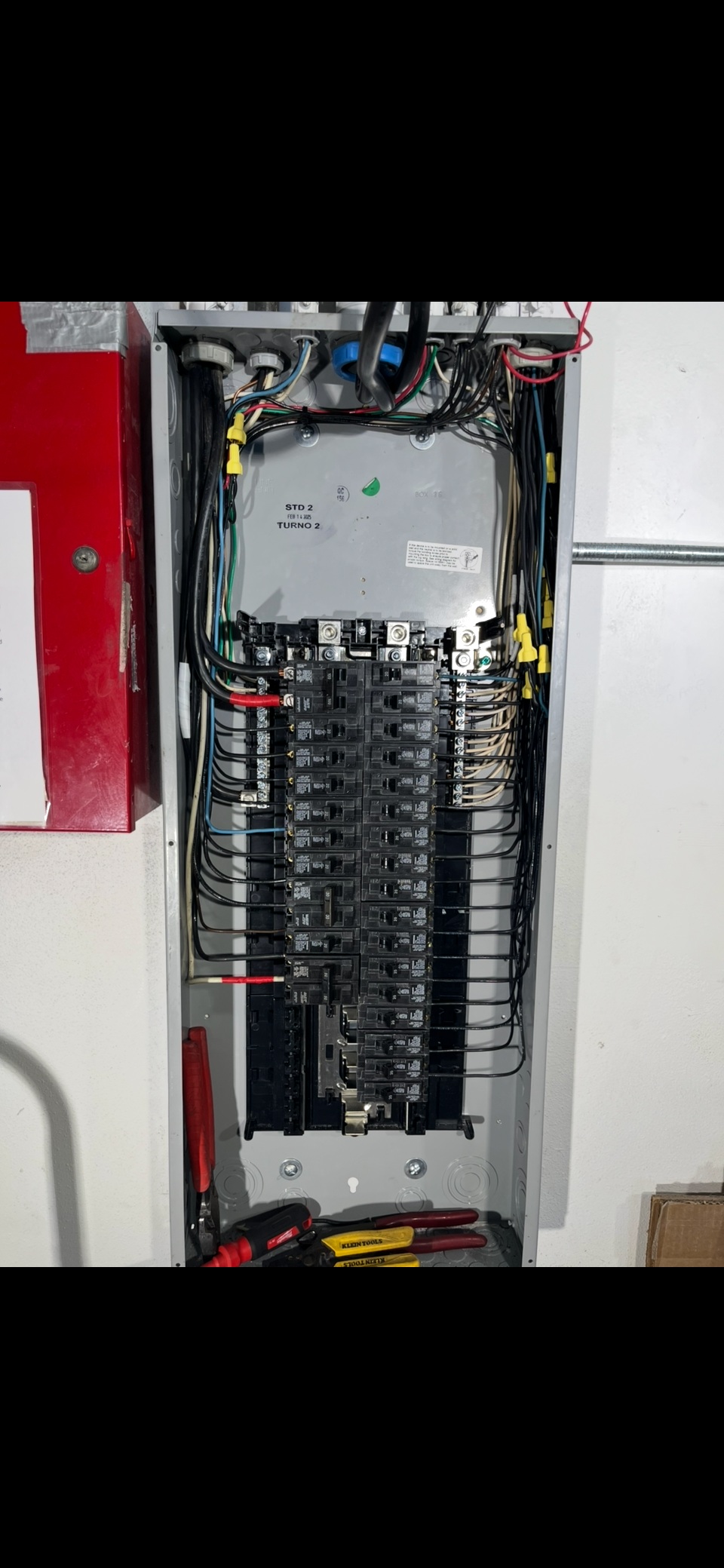 Electrical panel installation with organized wiring and circuit breakers by expert electrician