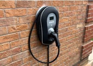 Professional EV charger installation on exterior brick wall by Denali Electric licensed electrician
